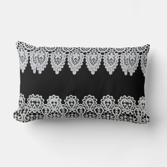 White lace forms a delicate border against black lumbar cushion (Front)