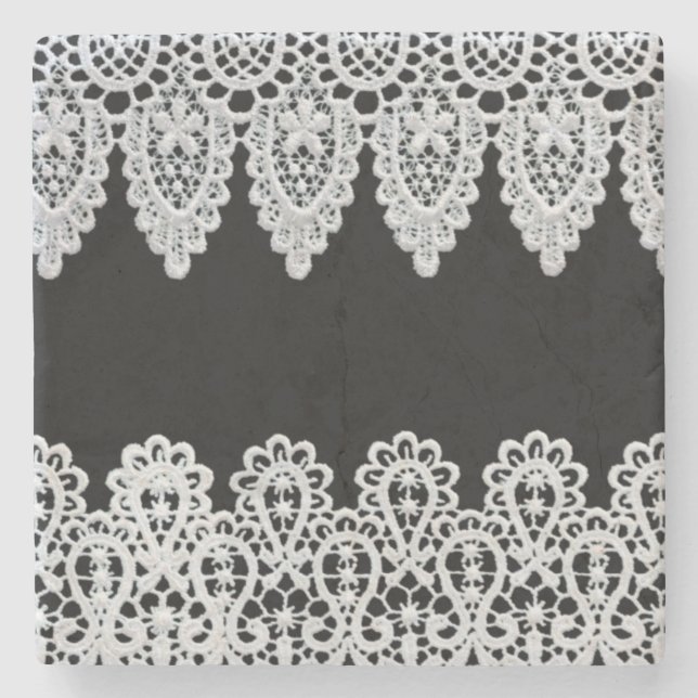 White lace forms a delicate border against black stone coaster (Front)