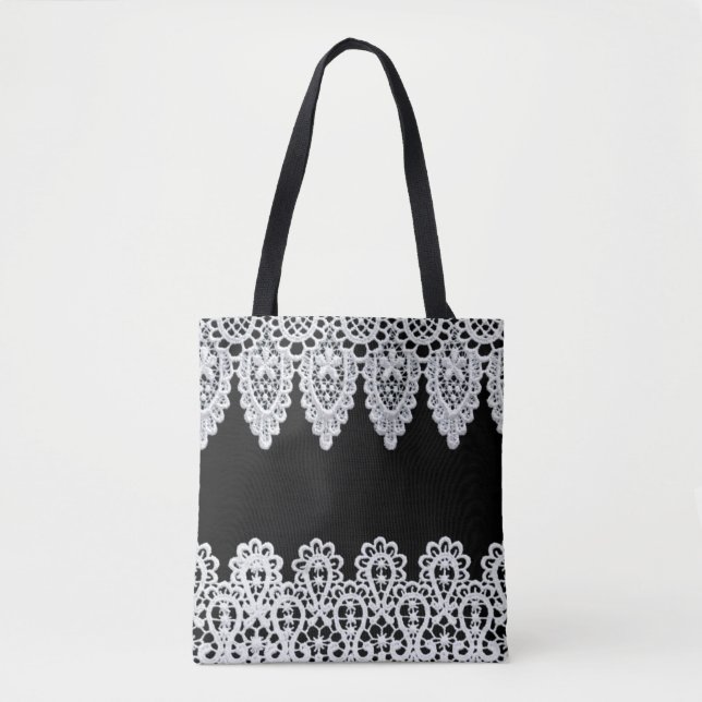 White lace forms a delicate border against black tote bag (Front)