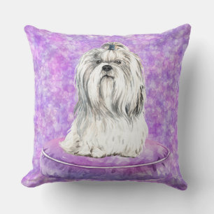 WHITE MALTESE DOG SITTING IN PURPLE DOG BED CUSHION