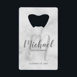 White Marble Modern Script Personalised Groomsmen<br><div class="desc">Add a personal touch to your wedding with personalised groomsmen credit card bottle opener. This bottle opener features personalised groomsmen's name in grey modern script font style and monogram in light grey modern script font style as background with title and wedding date in grey modern sans serif font style on...</div>