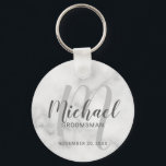 White Marble Modern Script Personalised Groomsmen Key Ring<br><div class="desc">Add a personal touch to your wedding with personalised groomsmen keychain. This keychain features personalised groomsmen's name in grey modern script font style and monogram in light grey modern script font style as background with title and wedding date in grey modern sans serif font style on white marble background. Also...</div>
