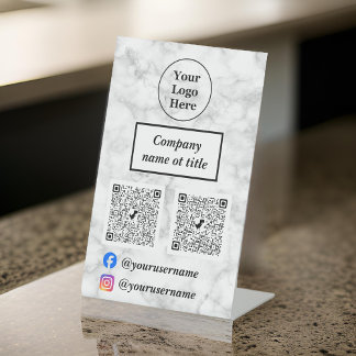 White marble pedestal sign