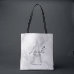 White Marble Script Personalised Bridesmaid's Name Tote Bag<br><div class="desc">Modern Minimalist Personalised Monogram and Name Gifts This design features personalised bridesmaid's name in grey modern handwriting script font style and monogram in light grey modern sans serif font style as background, with wedding details in grey modern sans serif font style, on white marble background. Also perfect for maid of...</div>