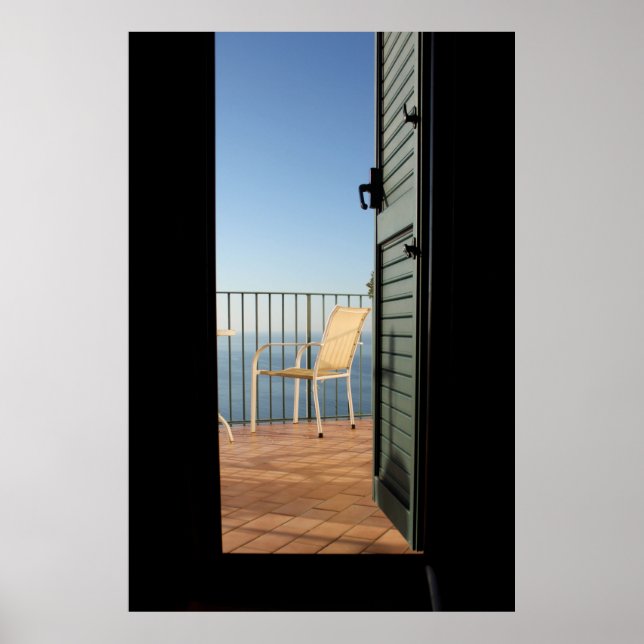 White metal armchair beside fence in the morning poster (Front)