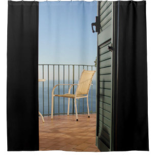 White metal armchair beside fence in the morning shower curtain
