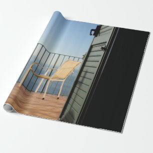 White metal armchair beside fence in the morning wrapping paper