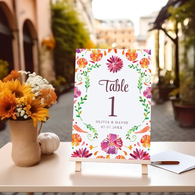 White Mexican Floral Fiesta Wedding Table Number (White Mexican Floral Fiesta Wedding Table Number on a table with flowers.)