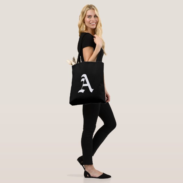 White monogram A on black Tote Bag (On Model)