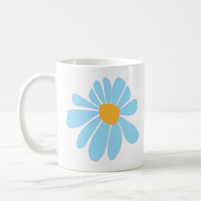 white mug with a soft blue hand-drawn daisy (Left)