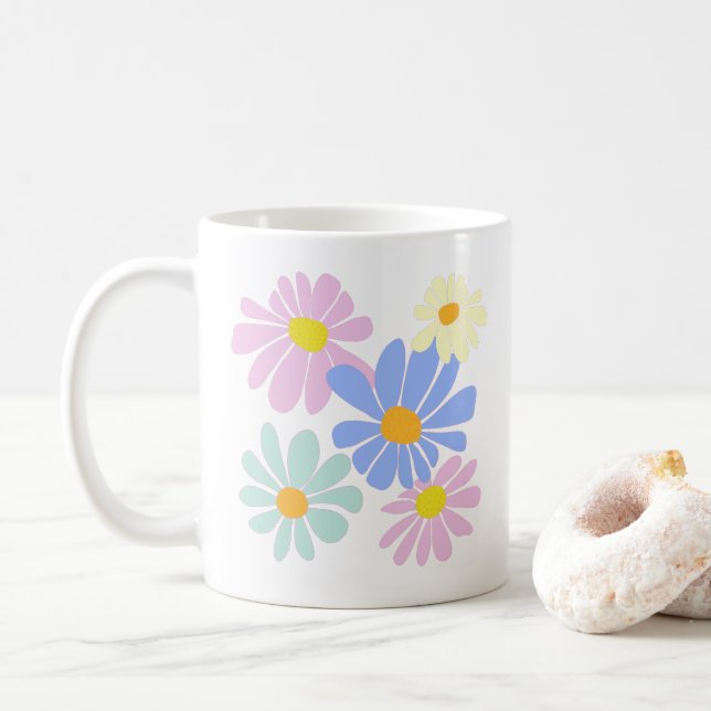 white mug with burst of daisies front and back (With Donut)