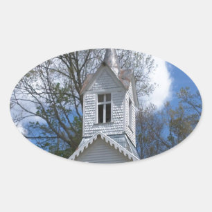white old church in the mountains oval sticker