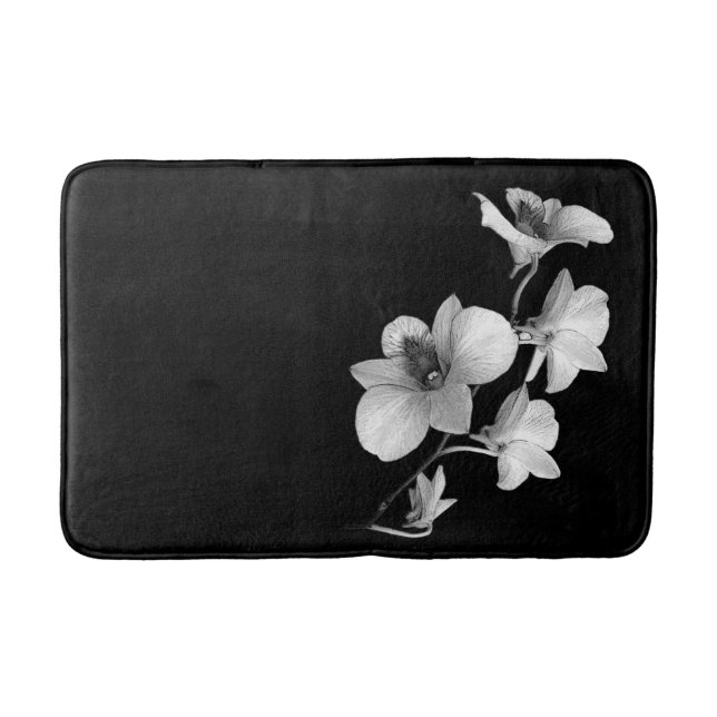 White Orchid on Black Bath Mat (Front)