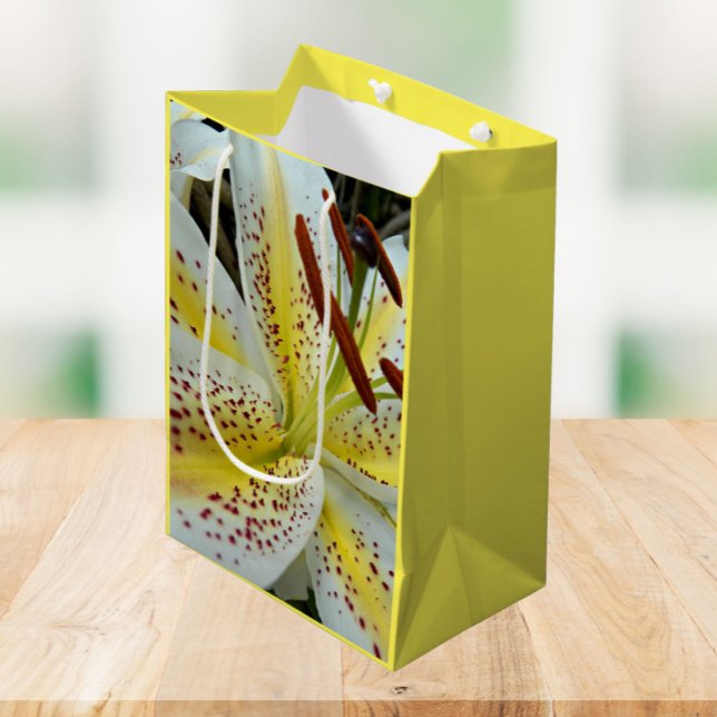 White Oriental Lily with Yellow Starburst Floral Medium Gift Bag (In Situ)