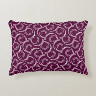White ornament on a burgundy background. decorative cushion
