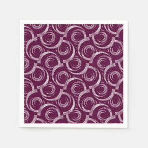 White ornament on a burgundy background. napkin