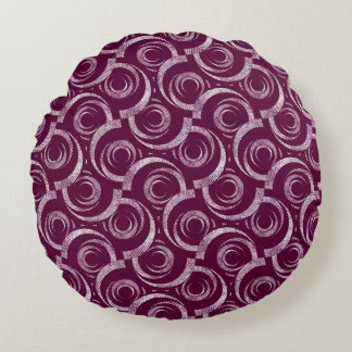 White ornament on a burgundy background. round cushion