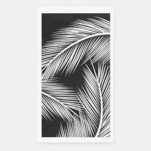 White palm leaves on black colour background napkin