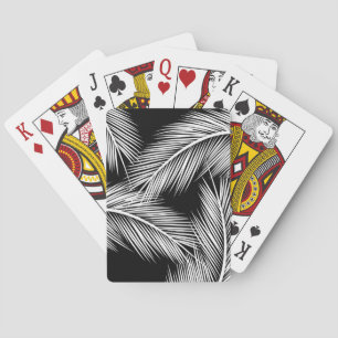 White palm leaves on black colour background playing cards