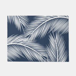 White palm leaves on dark blue colour background doormat