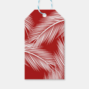 White palm leaves on red colour background gift tags