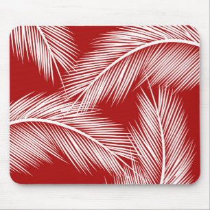 White palm leaves on red colour background mouse mat
