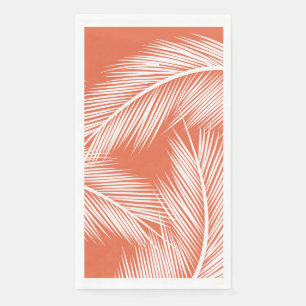 White palm leaves on salmon colour background napkin