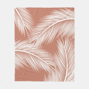 White palm leaves on terracotta colour background fleece blanket