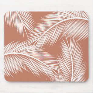 White palm leaves on terracotta colour background mouse mat