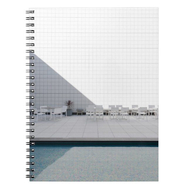WHITE PATIO TABLE WITH CHAIRS DURING DAYTIME NOTEBOOK (Front)