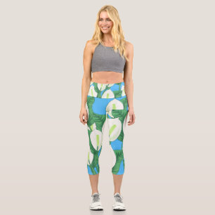 White peace lilies on pale blue background capri leggings