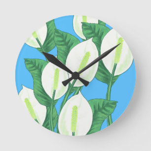 White peace lilies on pale blue background  round clock