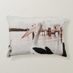 WHITE PELICAN ON BODY OF WATER DURING DAYTIME DECORATIVE CUSHION