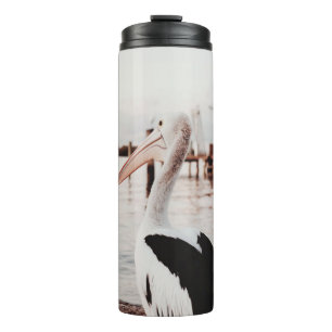 WHITE PELICAN ON BODY OF WATER DURING DAYTIME THERMAL TUMBLER