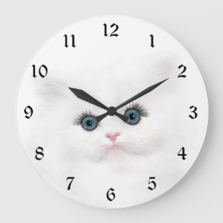 White persian kitten face large clock
