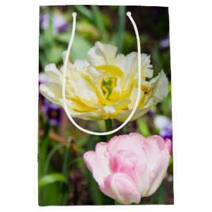 White, pink and yellow tulips in the garden       medium gift bag