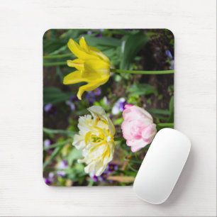 White, pink and yellow tulips in the garden mouse mat