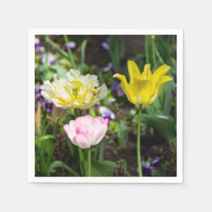 White, pink and yellow tulips in the garden napkin