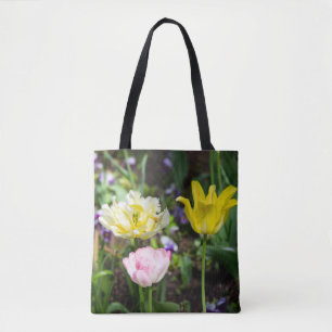 White, pink and yellow tulips in the garden tote bag