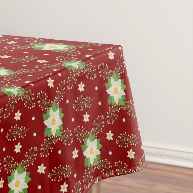 White Poinsettias Green Leaves Christmas on Red Tablecloth (In Situ)