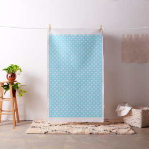 White polka crosses on baby blue fabric