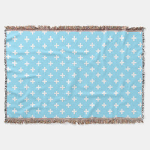 White polka crosses on baby blue throw blanket