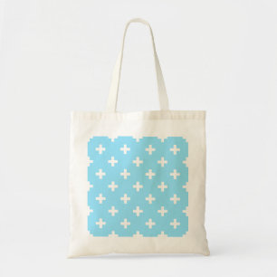 White polka crosses on baby blue tote bag