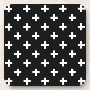 White polka crosses on black coaster