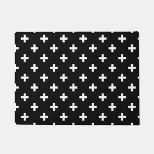 White polka crosses on black doormat