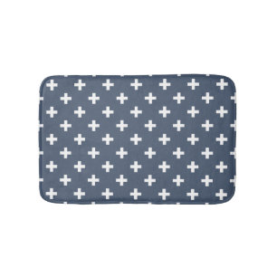 White polka crosses on blue-grey bath mat