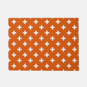 White polka crosses on burnt orange doormat