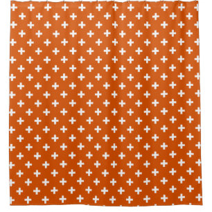 White polka crosses on burnt orange shower curtain