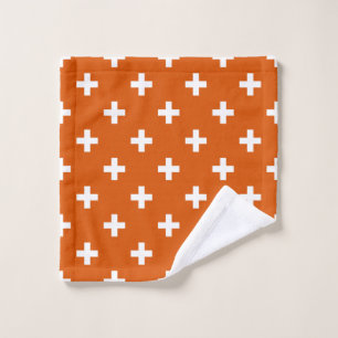 White polka crosses on burnt orange wash cloth