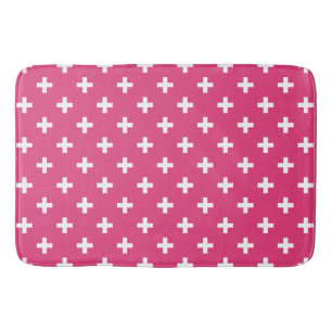 White polka crosses on fuchsia bath mat